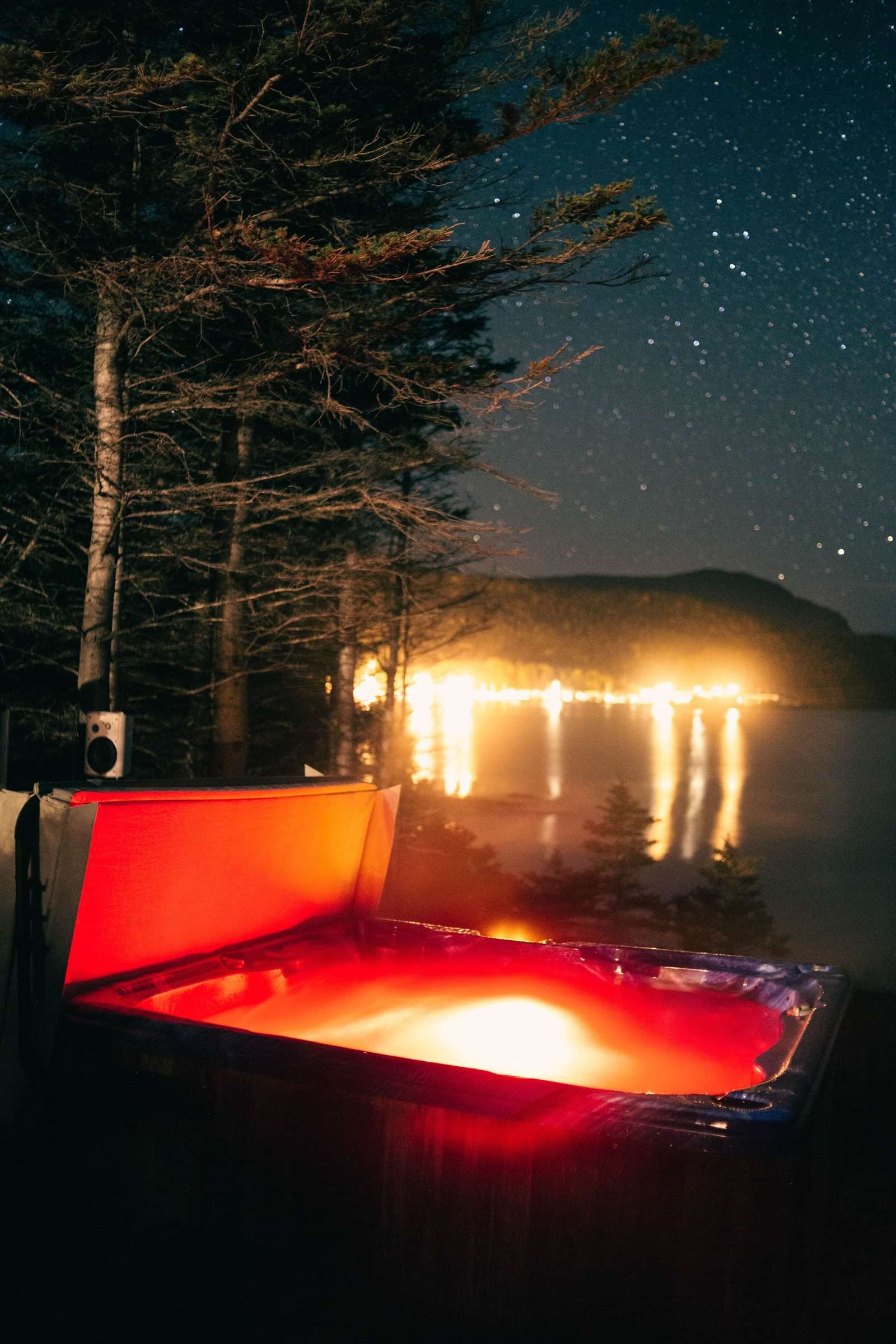 A hot tub glowing at night